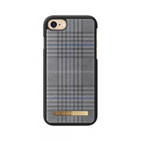 Szare etui iDeal of Sweden w kratę do iPhone 6, 6s, 7, 8 oraz SE 2020 z wycięciem na aparat i złotym logotypem marki umieszczonym w dolnej części obudowy.