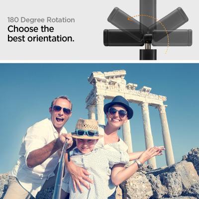 Selfie stick Spigen S550W LED w kolorze czarnym z funkcją obrotu o 180 stopni, używany przez rodzinę do wspólnego zdjęcia na tle antycznych ruin.