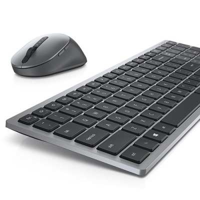 Bezprzewodowy zestaw Dell KM7120 składający się z szarej myszy o ergonomicznym kształcie oraz niskoprofilowej klawiatury z układem klawiszy w kolorze czarnym.