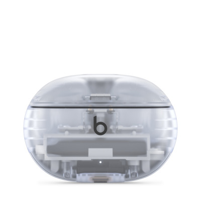 Przezroczyste etui ładujące słuchawek Beats Studio Buds Plus z widocznym wnętrzem konstrukcji, logiem Beats na środku oraz diodą stanu na dole.