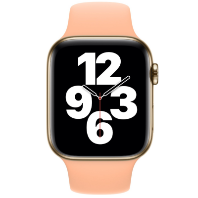 Złoty Apple Watch z silikonowym paskiem w kolorze Cantaloupe, widoczna tarcza z cyframi 12, 3, 6, 9 oraz wskazówkami zegara na czarnym tle.