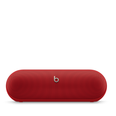 Bezprzewodowy głośnik Beats Pill w kolorze matowej czerwieni z charakterystycznym srebrnym logo marki Beats umieszczonym centralnie na przedniej maskownicy.