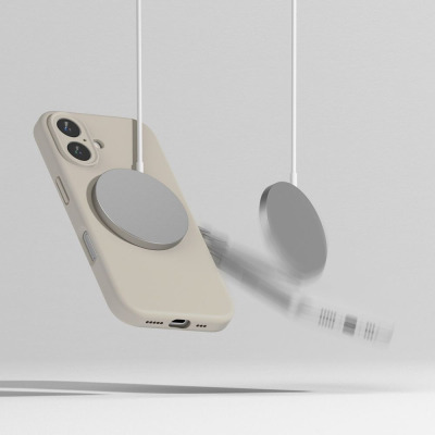 Kremowe etui Ringke Silicone MagSafe do iPhone 16 w zawieszeniu, z widoczną magnetyczną ładowarką przyczepioną do plecków oraz rozmytym ruchem urządzenia.