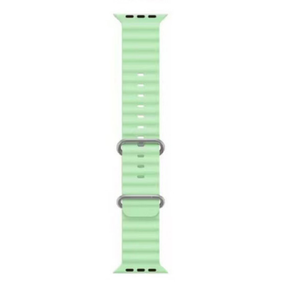 Pistacjowy pasek silikonowy Jinya do Apple Watch z perforowaną strukturą, założony na kopertę zegarka w kolorze tytanowym z widoczną cyfrową tarczą.